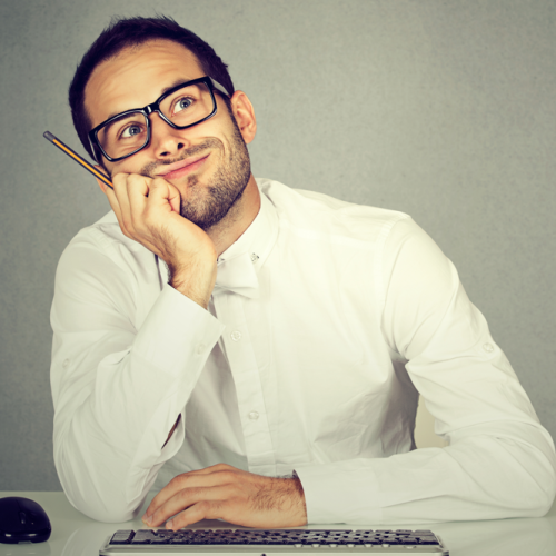 a procrastinating university student sitting at his desk unable to focus on his assignment (procrastination ADHD and managing focus)